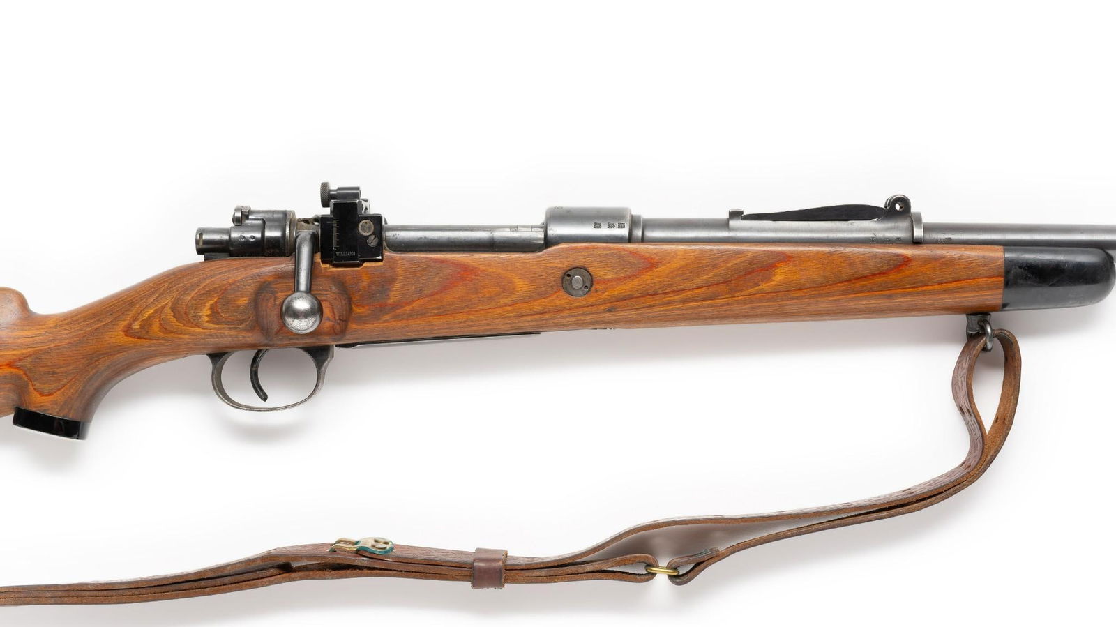 Model K98 German Mauser Bolt Rifle, Sporterized, Caliber 8mm Mauser: Serial Number 2154 Design: This Mauser is marked "Mod 98" on left of receiver and "27" and "1939" on the receiver ring. 3rd Reich eagles appear on both the barrel and the receiver. Matching numbers th