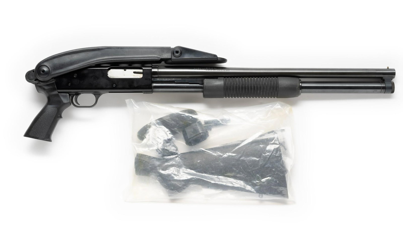 Mossberg Model 500A Pump Shotgun w/ Two Stocks, 12 Gauge: Serial Number: P903028 Design: This Mossberg Model 500A shotgun has a 20 3/4" barrel, cylinder bore. It comes with two stocks--one a conventional black polymer stock and the other an Advanced Technolo
