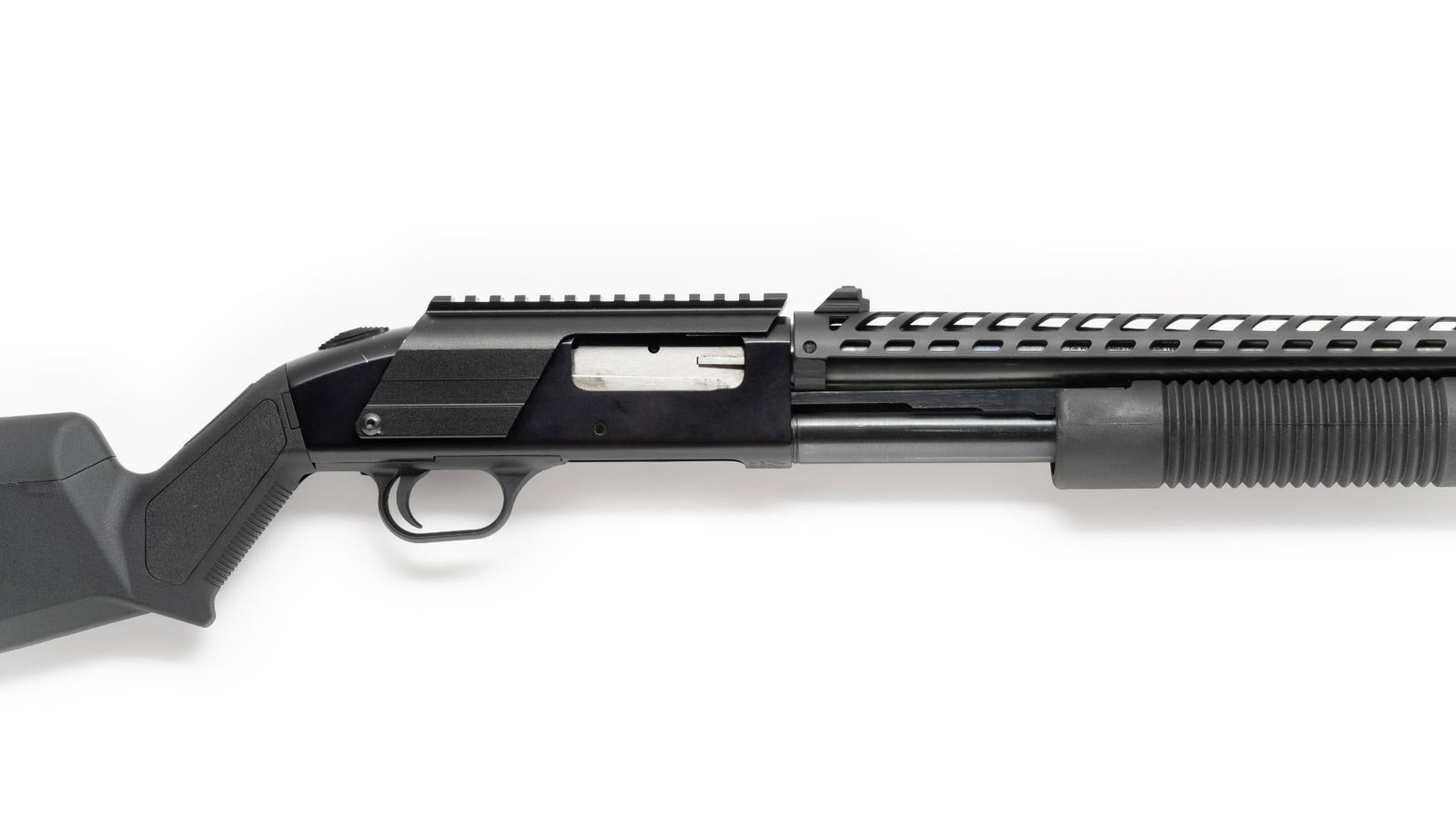 Mossberg Model 500A Pump Action Shotgun, 12 Gauge.: Serial Number: L529245 Design: This Mossberg Model 500A pump action shotgun has an 18" barrel, cylinder bore, which accepts both 2 3/4" and 3" 12 gauge shells. Blued finish. Perforated hand guard with