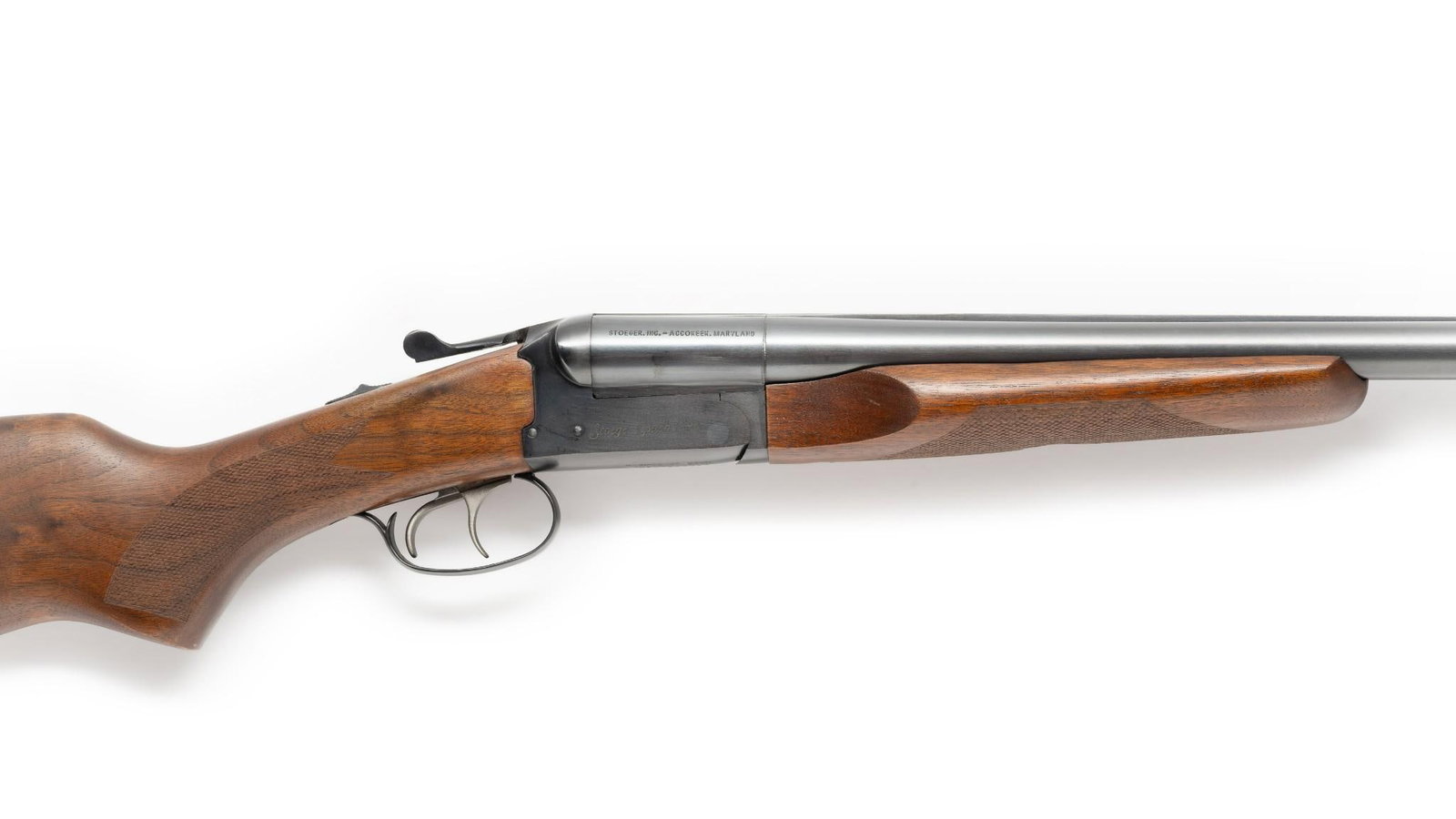Stoeger "Coach Gun" Side-by-Side Double Shotgun, 12 Gauge: Serial Number: 835385-15 Design: This "Coach Gun" side-by-side double barrel shotgun was made in Brazil by E.R. Amantino and distributed in U.S.A. by Stoeger, Inc. of Accokeek, MD. 20" barrels, modifi