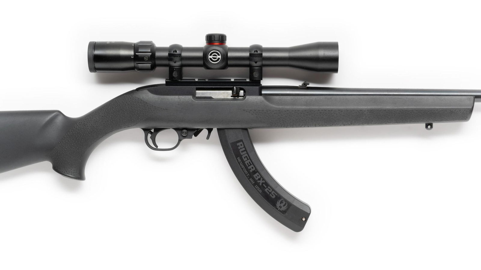 Ruger Model 10-22 Semi Automatic Rifle w/ Scope, Caliber .22lr: Serial Number: 0001-67077 Design: This Ruger Model 10/22 semi automatic rifle has an 18 1/2" barrel with a 2 1/2" compensator which is removable with an Allen hex key. Marked on left of receiver "Fift