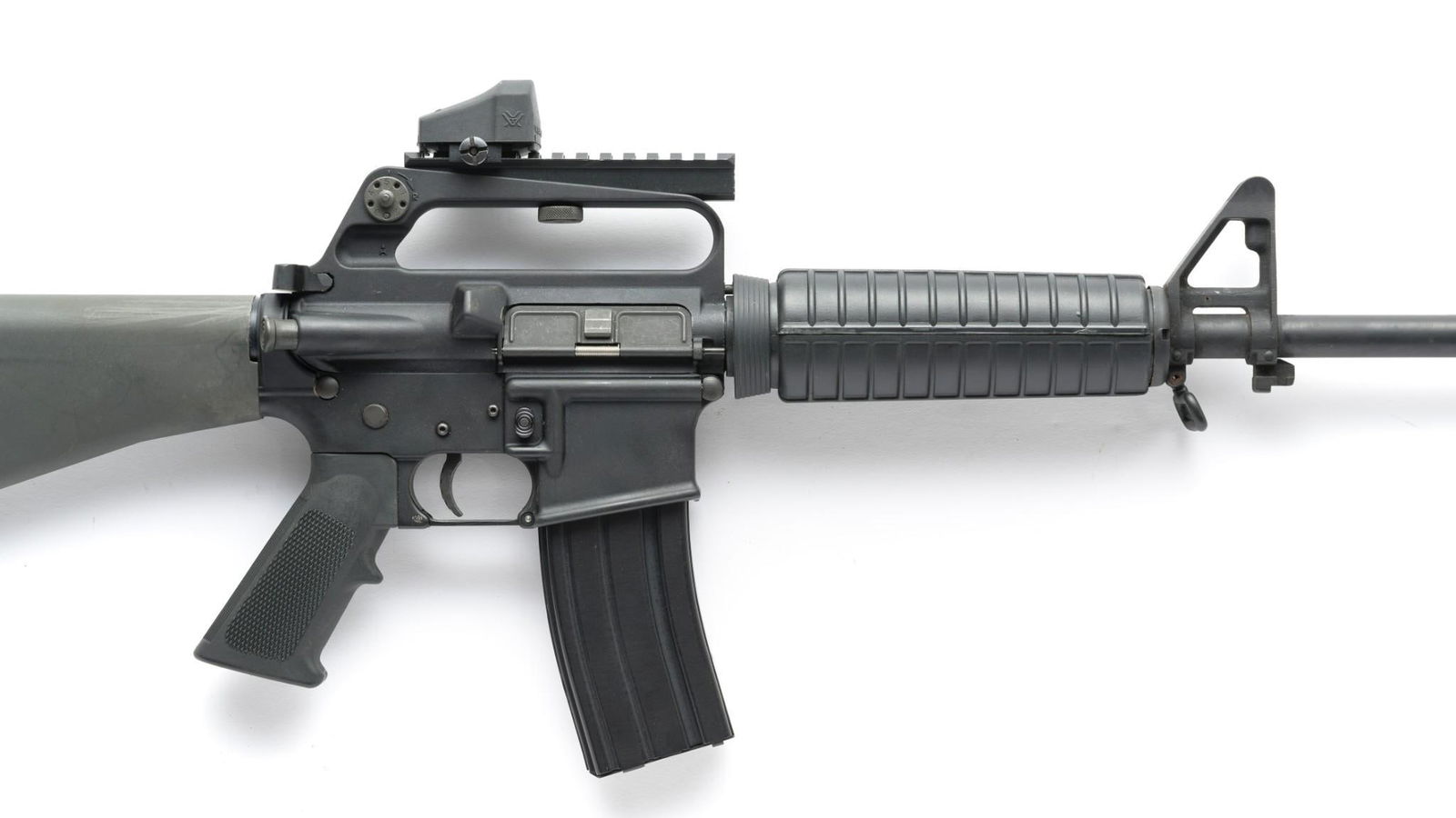 Olympic Arms Model M.F.R. (AR15 style) Semi Auto Rifle, Caliber 5.56 NATO: Serial Number: TB9883 Design: The Olympic Arms M.F.R. is an AR15 style semi automatic rifle now set up for the 5.56 NATO round. 16" button rifled barrel w/ compensator, 1/9 twist. This example has a f
