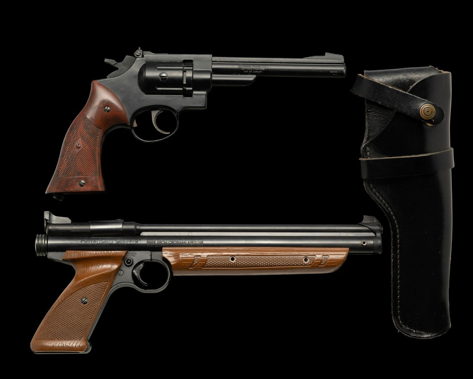 Lot of Two (2) Crosman air/gas Pistols, Model 38T (CO2) and Model 1377 (air).: Gun 1--Crosman American Classic air gun, Model 1377. Caliber .177. Serial # 093312689. Hand pump action. Gun 2--Crosman Model 38T CO2 gas revolver. Caliber .22 pellet. No serial number. Black holster