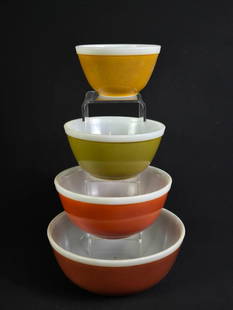 4 Pyrex Nesting Bowls: Smallest: 5-3/4" diameter x 3-1/4" high. Largest: 10-1/2" diameter x 4-1/2" high. All with scratches to exterior.