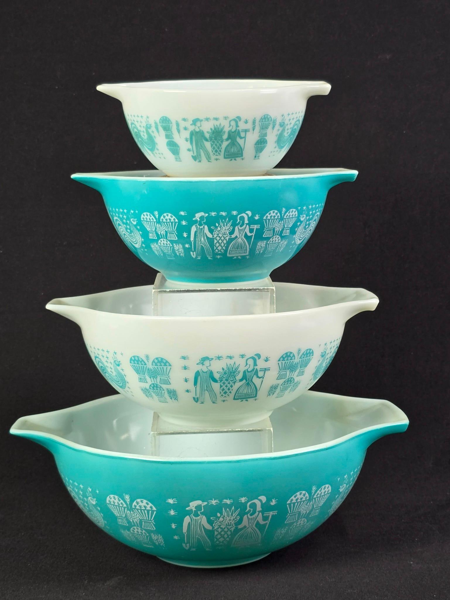 4 Pyrex "Butterprint" Nesting Cinderella: Smallest: 7-1/2" wide x 6" deep x 3-1/4" high. Largest: 13" wide x 10-1/2" deep x 4-1/2" high. Some utensil marks to interiors.