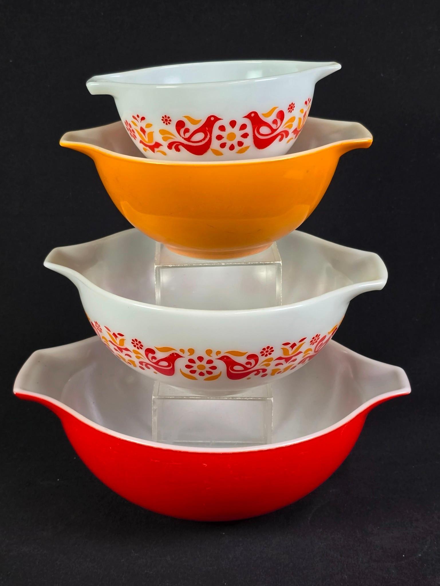 4 Pyrex Nesting Cinderella Bowls incl Friendship Birds: Includes red, white, orange, and friendship (bird) bowls with pour spouts. Smallest: 7-1/2" wide x 6" deep x 3-1/4" high. Largest: 13" wide x 10-1/2" deep x 4-1/4" high.