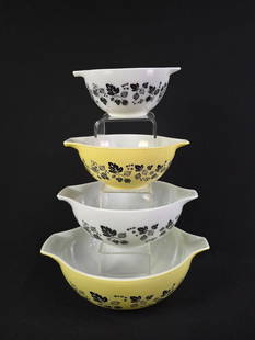 4 Vintage Pyrex "Gooseberry" Nesting Cinderella Bowls: Alternating yellow and white bowls. 7-1/2" to 13" wide. Largest bowl with loss to one handle.