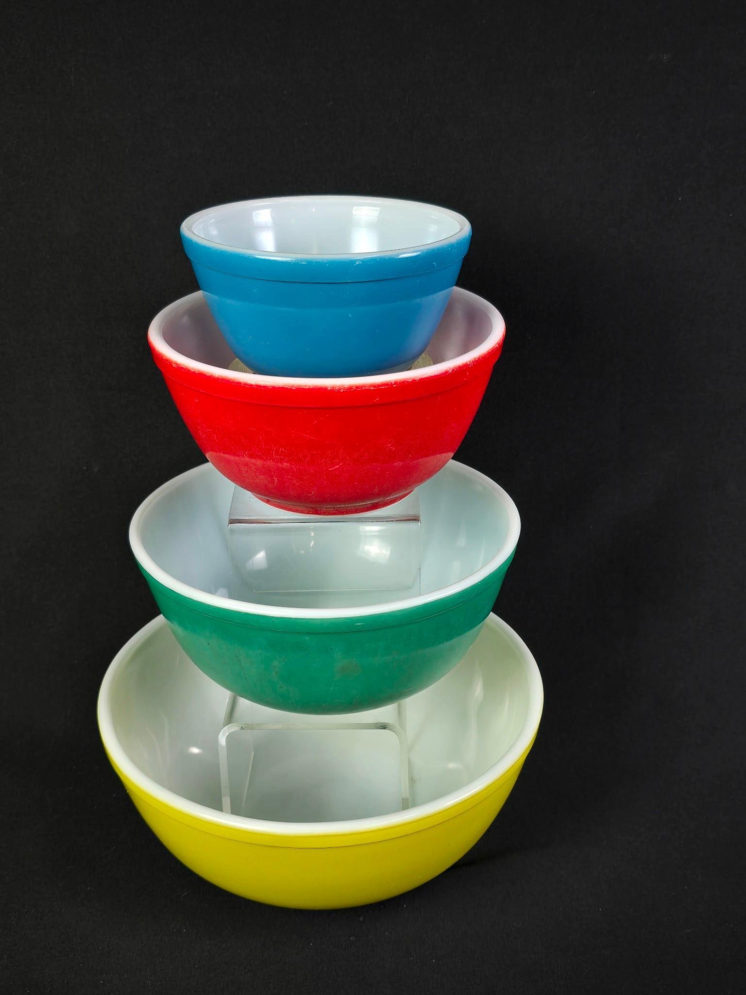 4 Multi-Colored Vintage Pyrex Nesting Bowls: 5-3/4" to 10-1/2" diameter. Some scratches and paint losses.