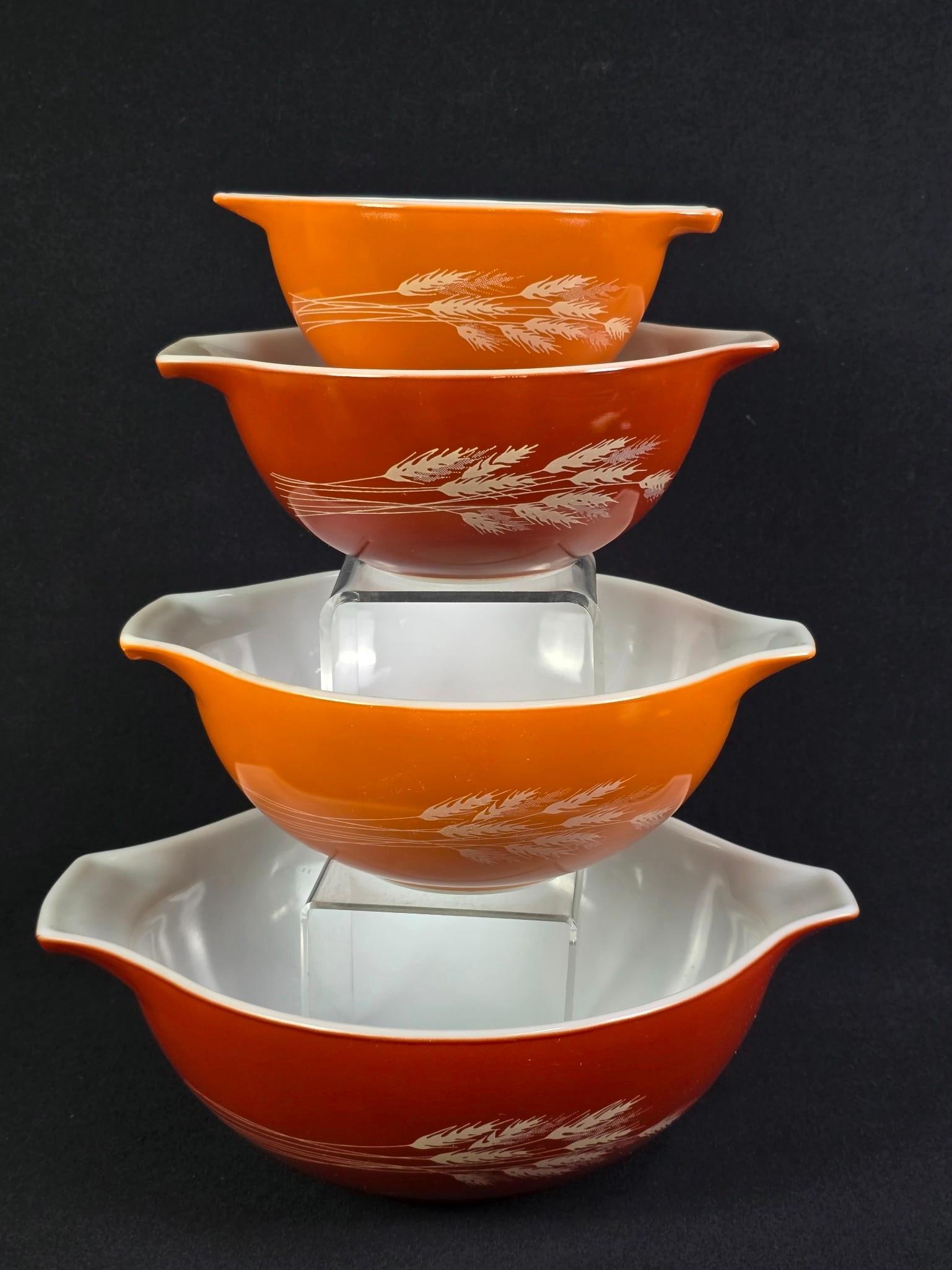4 Pyrex "Autumn Harvest" Cinderella Nesting Bowls: 7-1/2" to 13" wide. Minor scratches.