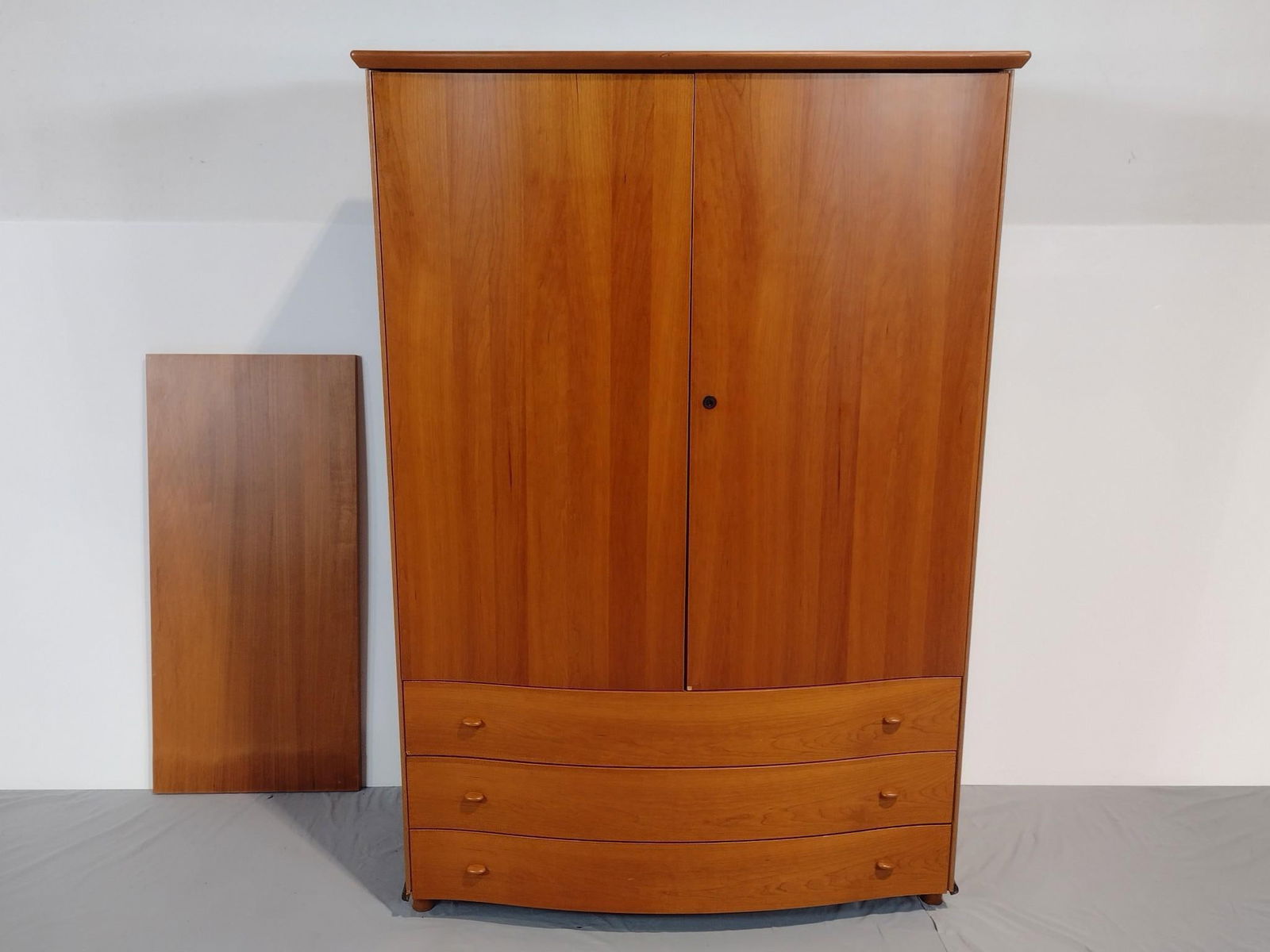 Modern Armoire: NOT ELIGIBLE FOR IN-HOUSE SHIPPING. 40-1/2" wide X 22" deep X 60" high. Missing key. Has a few light scratches and small areas of finish loss.