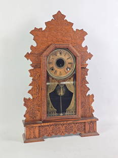 Antique Ansonia Clock: NOT ELIGIBLE FOR IN-HOUSE SHIPPING. Not working. Overall: 14-1/2" wide x 4-1/4" deep x 24" high. The pendulum is not original to the clock. Works are loose and not secure. Repairs and cracks to wood c
