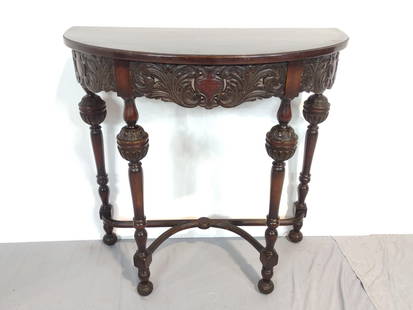 Carved Demilune Table: NOT ELIGIBLE FOR IN-HOUSE SHIPPING. 32" wide X 14" deep X 32" high. Has some scratches.