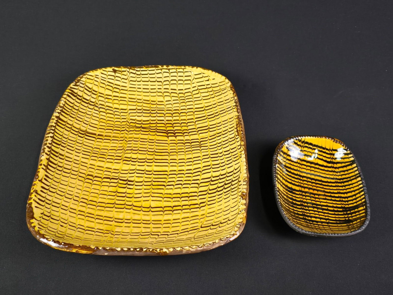 2 Pcs Williamsburg Pulled Feather Slipware: Smallest: 7-1/2" wide x 5-1/2" deep x 1-1/2" high. Largest: 15-1/2" wide x 12-1/2" deep x 2-1/2" high.