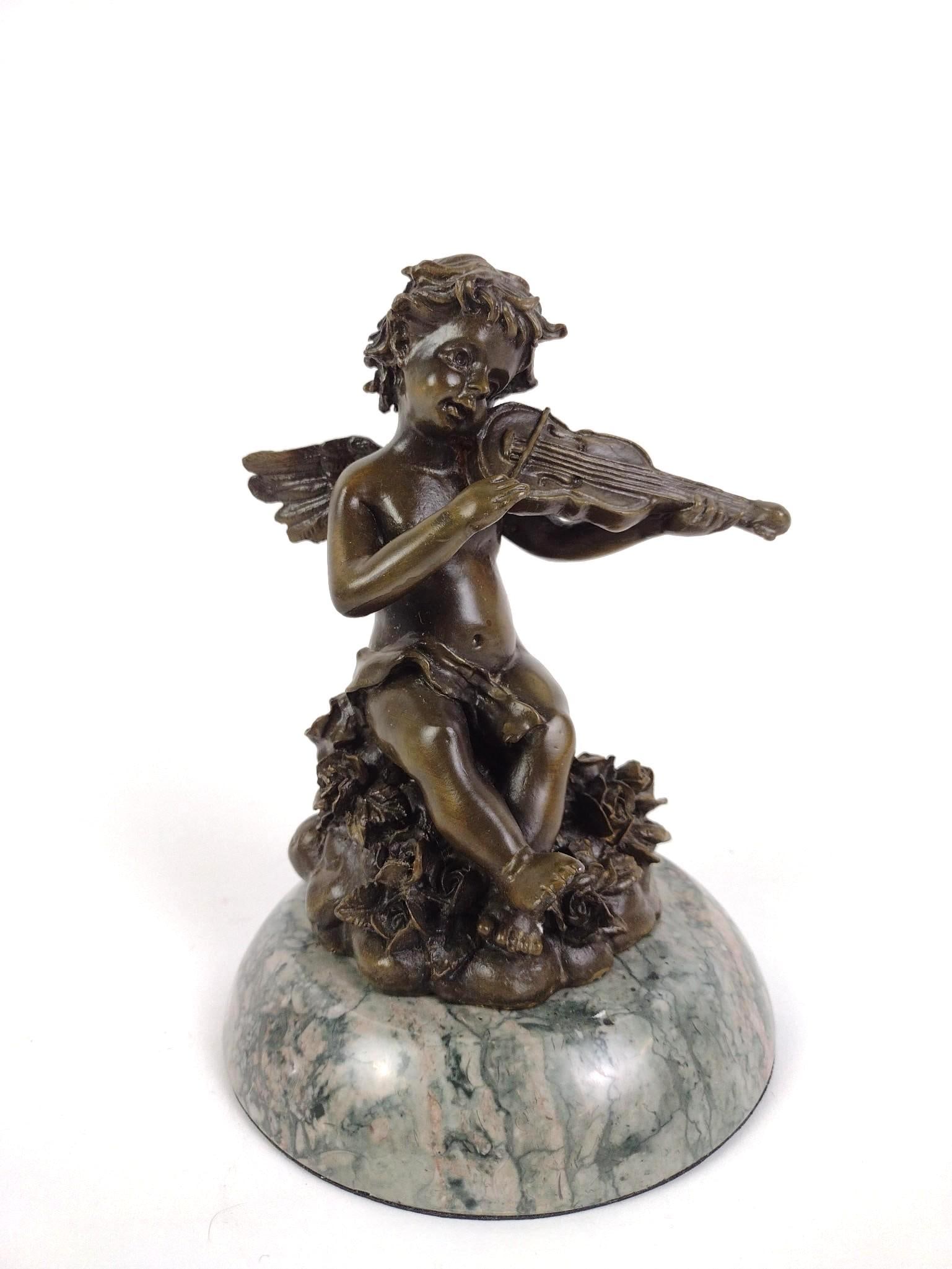 Bronze Statue Of Cherub: 5" diameter X 7" high.