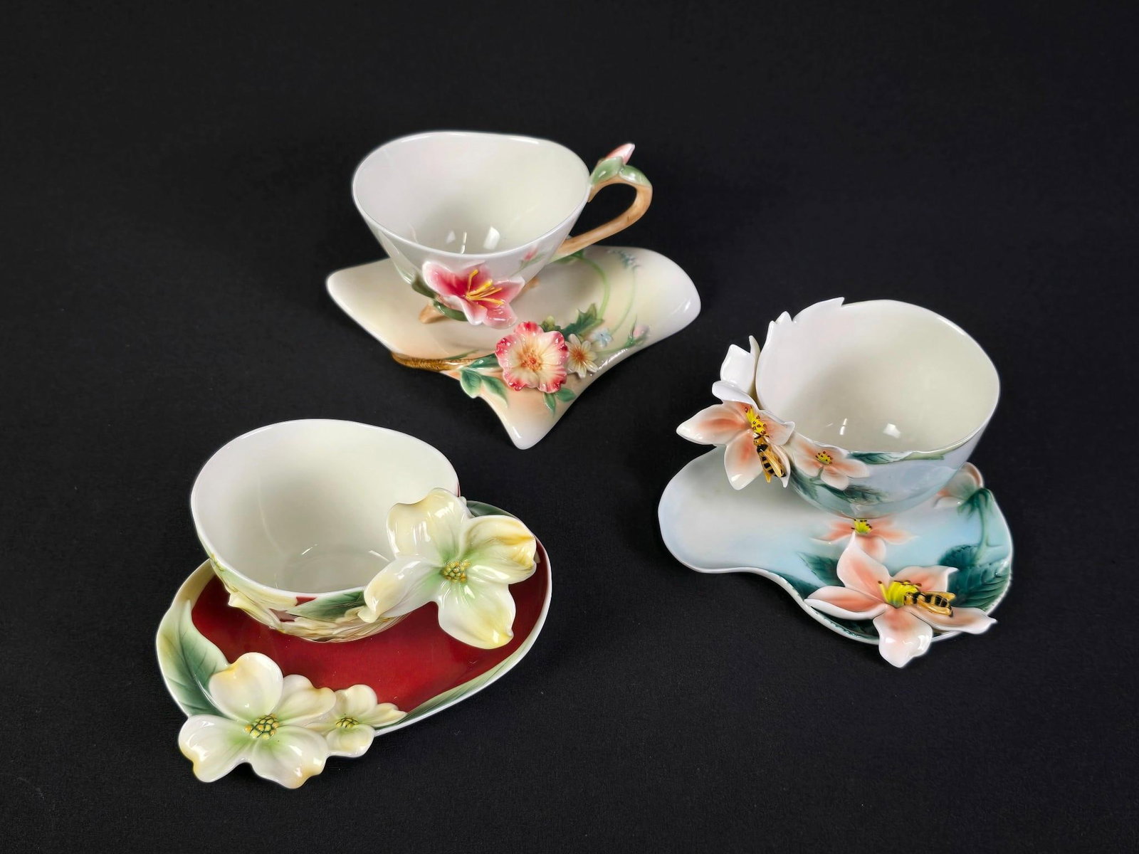 3 Franz Ceramics Featuring Flowers: Includes 3 cups and 3 saucers. 1/2" to 3-1/2" high.