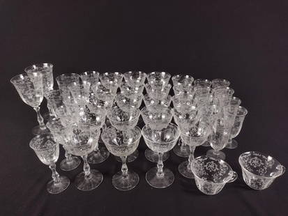 41 Pcs Fostoria "Novarre" Etched Drinkware: DESCRIPTION: Includes two cups, two claret glasses, one small ice tea glass, four goblets, ten ice tea glasses, five champagne, and fifteen cocktail glasses MEASUREMENTS: from 8-3/4" to 3-1/2" tall CO