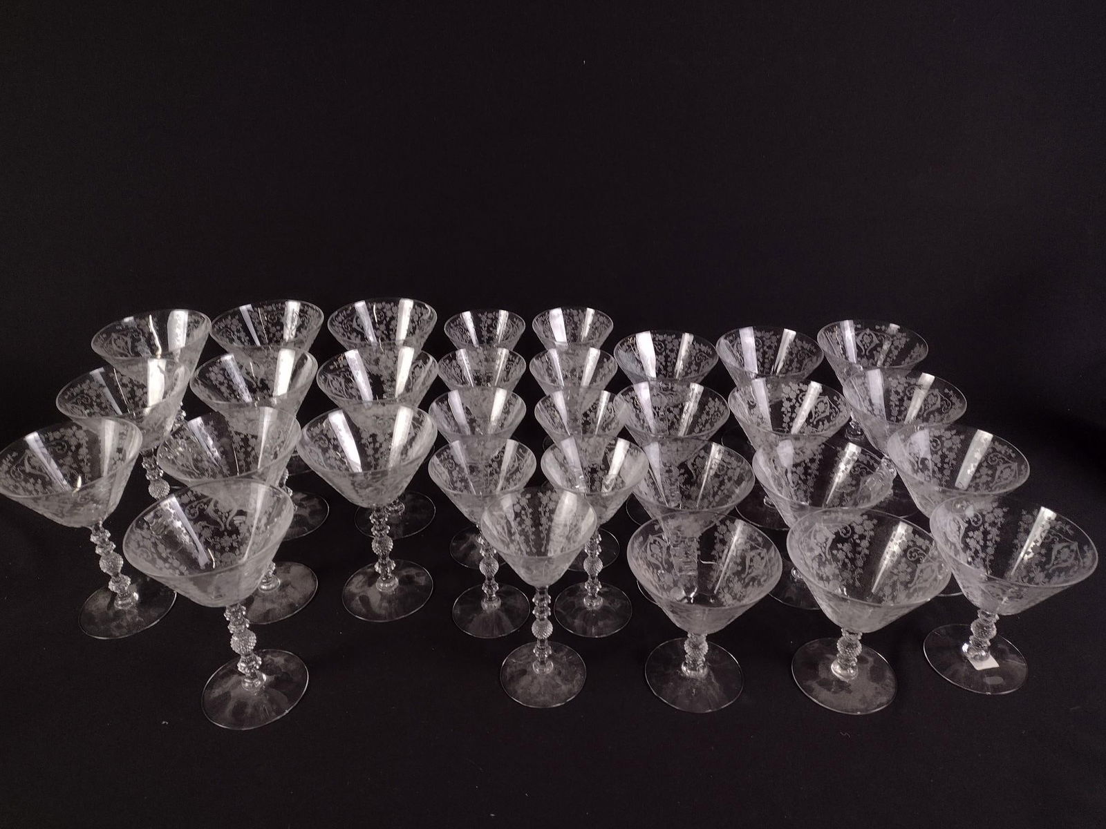 64 Cambridge "Diane" Etched Glassware Pcs: DESCRIPTION: Includes six cordial glasses, two oyster/fruit cocktail glasses, three claret wine glasses, two small goblets, five ice tea glasses, two large ice tea glasses, two smaller goblets, nine s