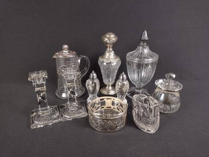 14 Pcs Silver Overlay: DESCRIPTION: Includes silver overlay salt and pepper shakers, scalloped mule shoe spoon rest, jar, candy dish, pair of candlesticks, pitcher with a pink enamel lid, perfume bottle, and a Heisey apothe