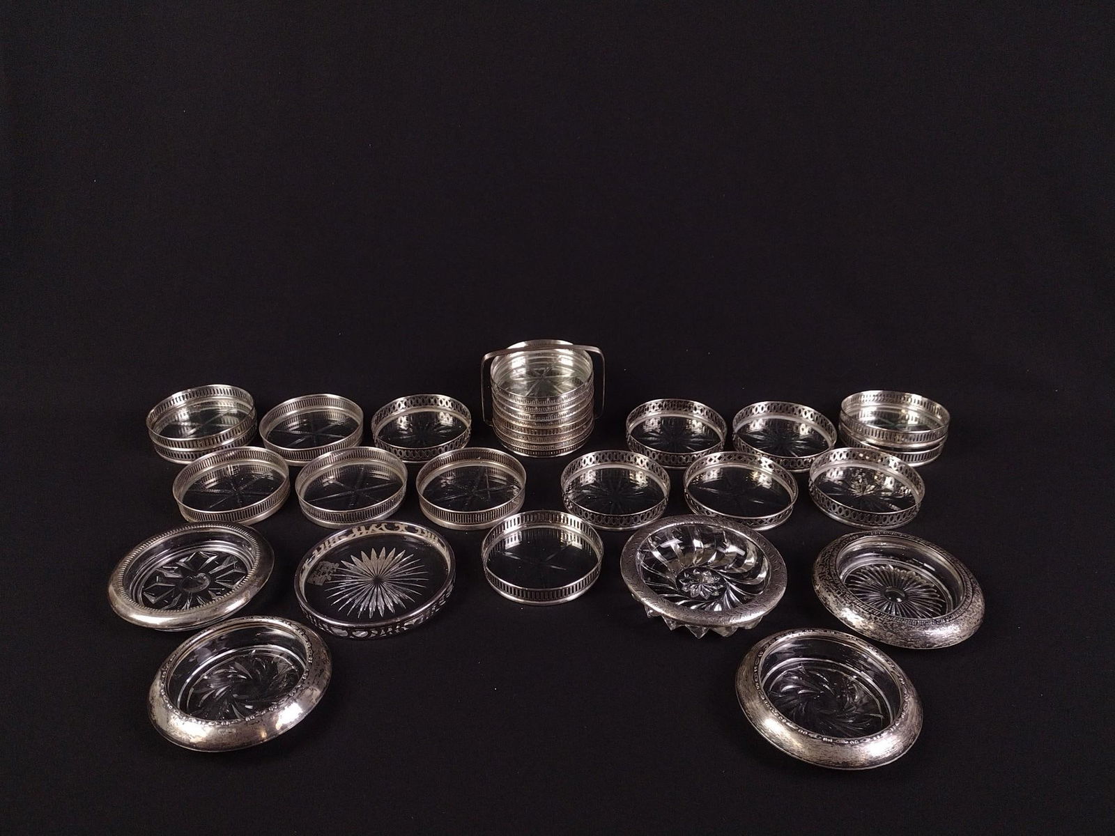 27 Sterling Rimmed Coasters: One coaster set includes carrier.