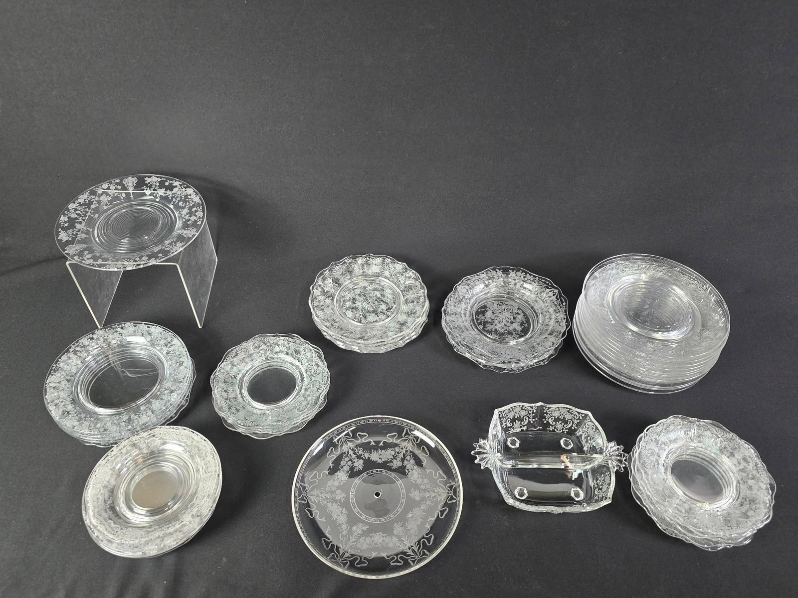 Large Grouping Etched Glassware: Mostly plates. Various patterns.