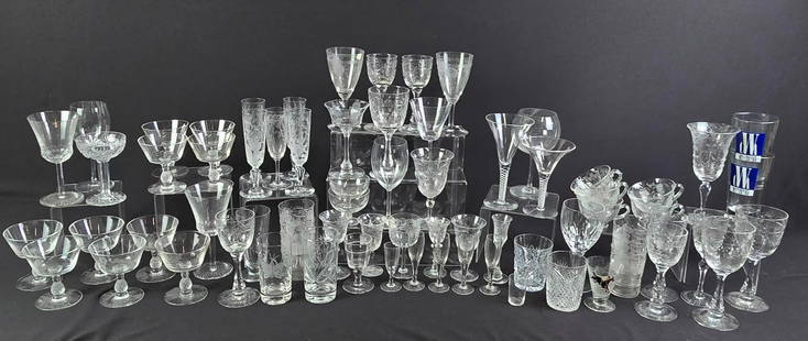 73 Pcs Glass Drinkware incl Etched: NOT ELIGIBLE FOR IN-HOUSE SHIPPING. Various patterns and styles. 2-1/4" to 8" high. Sold as is.