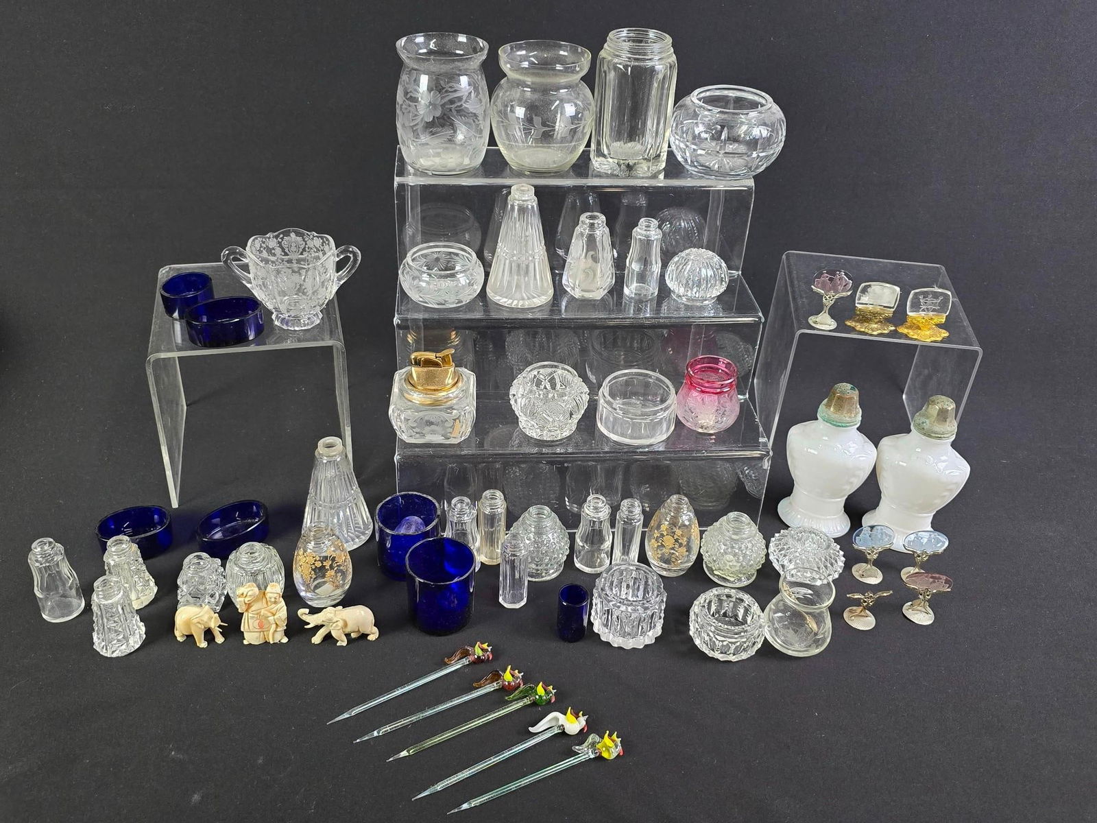 Large Grouping Shakers, Salts, Figurines and More!: NOT ELIGIBLE FOR IN-HOUSE SHIPPING. Includes 3 bone carvings, sizzle sticks, name card holders, and more.