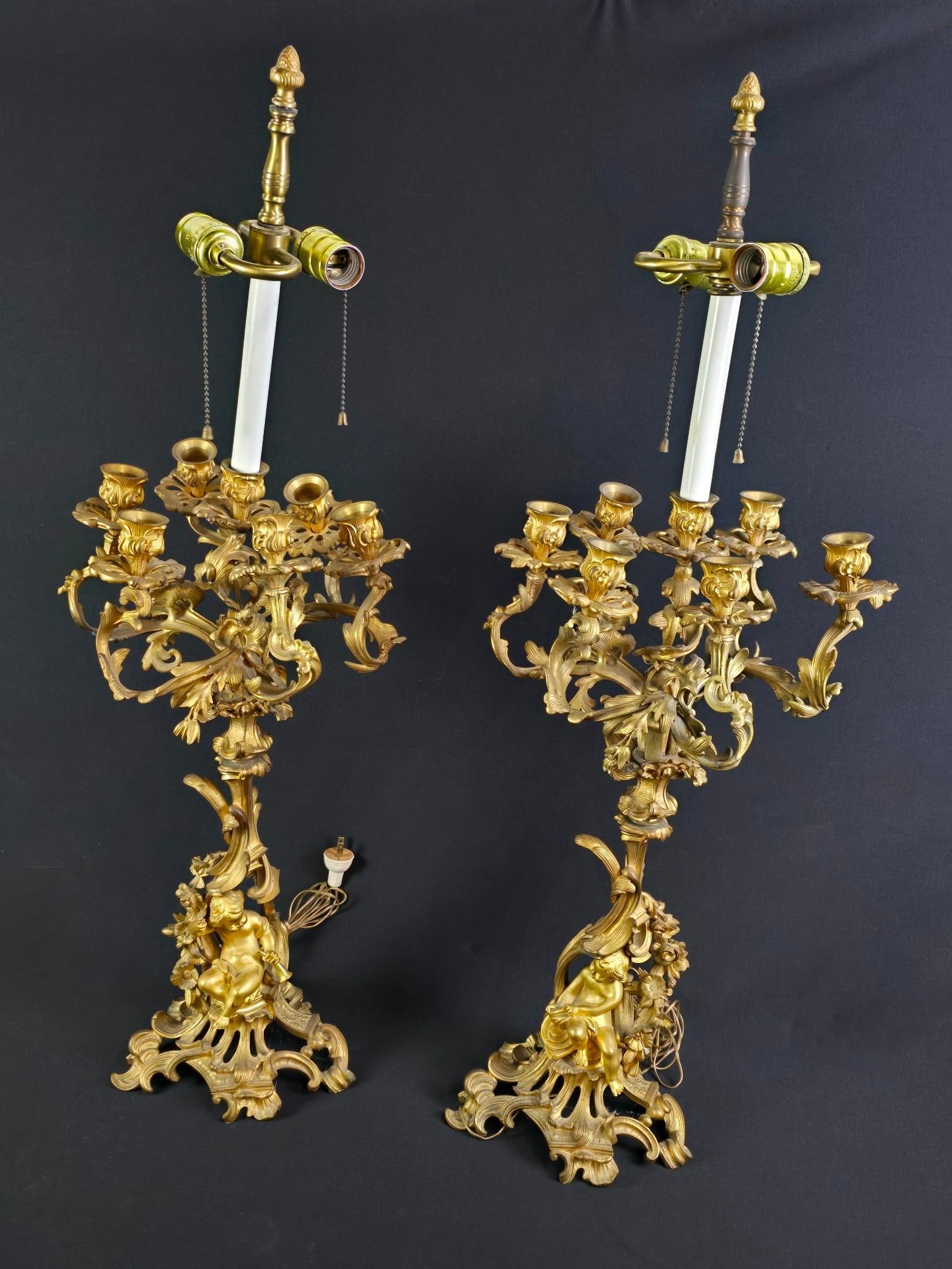 Pr French Rococo Figural Lamps: NOT ELIGIBLE FOR IN-HOUSE SHIPPING. Each: 12-1/2" diameter x 35-1/2" high. Some bends to candle socket arms.
