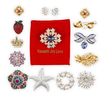 Costume Jewelry Brooches Including Kenneth Jay Lane: Mid century brooches and one pair of clip-on crystal earrings. Most are unsigned but those that are include a Weiss strawberry brooch and Kenneth Jay Lane Brooch with original pouch. The KJL brooch is