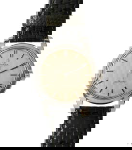 1956 Stainless Steel Automatic Omega Seamaster: Automatic Omega from 1956 with water proof snap-back case and fancy dial reflecting vertical lines. The dial is original and unrestored. 34 mm round. The watch runs and keeps time but not accuracy che