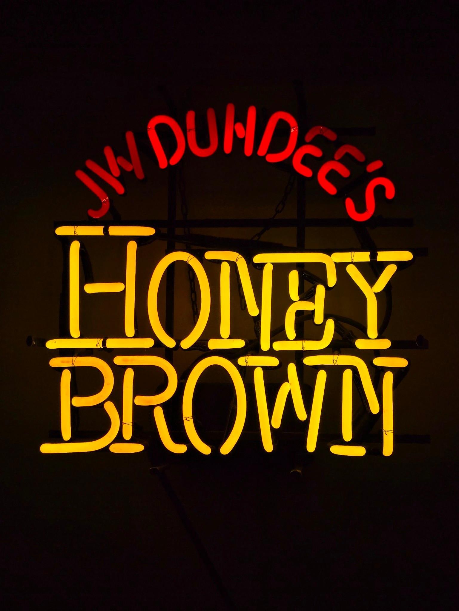J. W. Duhdee's Honey Brown Neon Sign: NOT ELIGIBLE FOR IN-HOUSE SHIPPING. Working. Overall: 17" wide x 7" deep x 17" high. Some losses to red paint (see photos). PROVENANCE: From the Collection of Robert L. Hassenplug—a proud veteran an