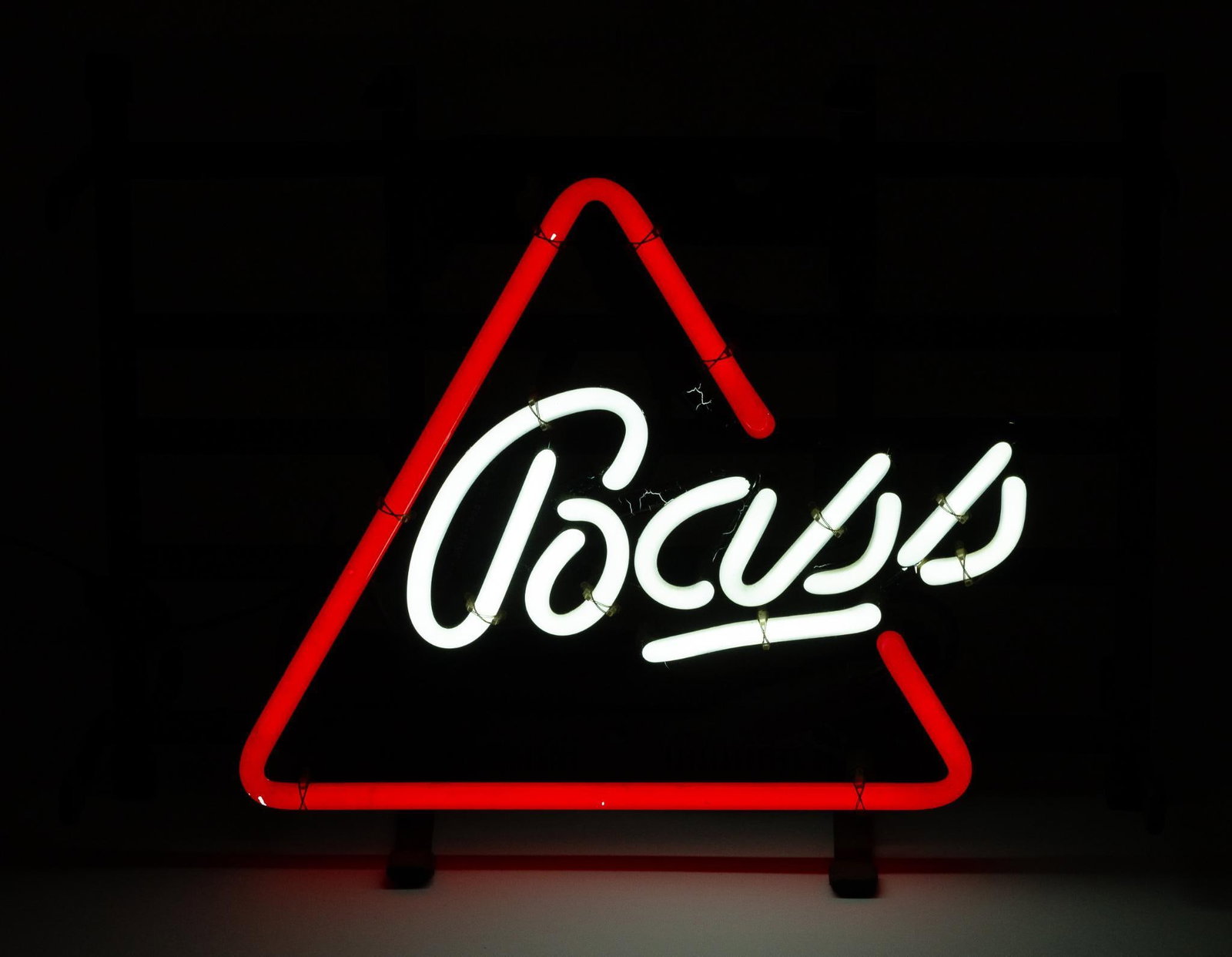 Bass Neon Sign: NOT ELIGIBLE FOR IN-HOUSE SHIPPING. Working. Overall: 14-1/2" wide x 6" deep x 10-1/2" high. PROVENANCE: From the Collection of Robert L. Hassenplug—a proud veteran and small business owner was an a