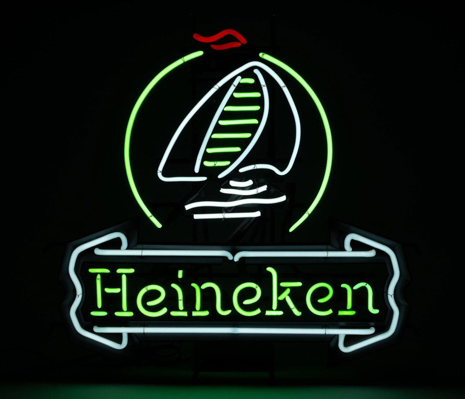 Heineken Sail Boat Neon Sign: NOT ELIGIBLE FOR IN-HOUSE SHIPPING. Working. Overall: 29" wide x 6-1/4" deep x 28-3/4" high. PROVENANCE: From the Collection of Robert L. Hassenplug—a proud veteran and small business owner was an a