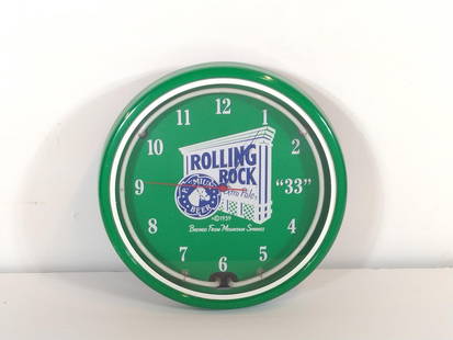 Rolling Rock Wall Clock: NOT ELIGIBLE FOR IN-HOUSE SHIPPING. 18-1/2" diameter. Untested. PROVENANCE: From the Collection of Robert L. Hassenplug—a proud veteran and small business owner was an avid and passionate collector