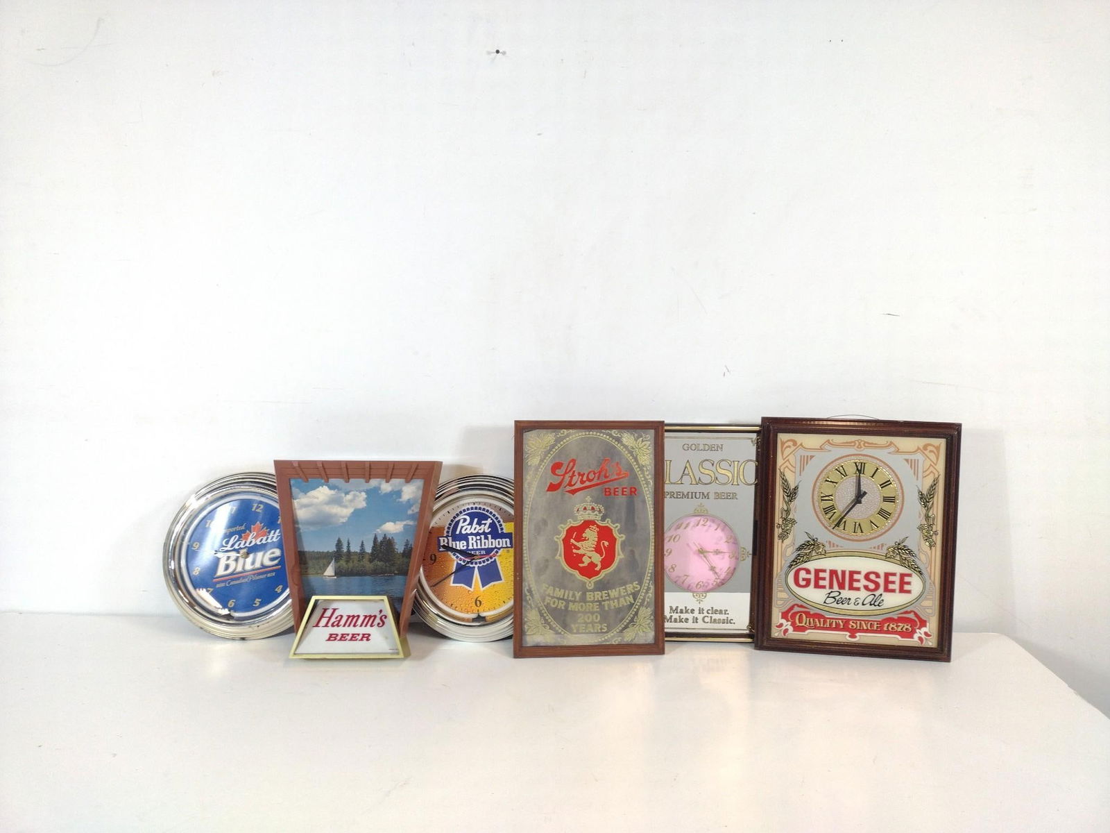 6 Beer Signs Incl Labatt Blue: NOT ELIGIBLE FOR IN-HOUSE SHIPPING. Also includes Hamm's, Pabst and more. 13" to 14-1/2" wide X 14" to 20" high. PROVENANCE: From the Collection of Robert L. Hassenplug—a proud veteran and small bus