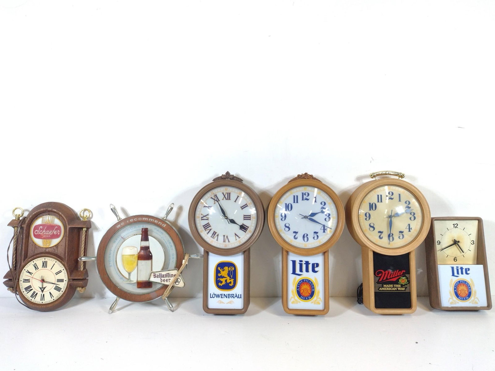 6 Beer Clocks Incl Schaefer: NOT ELIGIBLE FOR IN-HOUSE SHIPPING. Also includes Lowenbrau, Miller and more. 8" to 19" wide X 14" to 22" high. PROVENANCE: From the Collection of Robert L. Hassenplug—a proud veteran and small busi