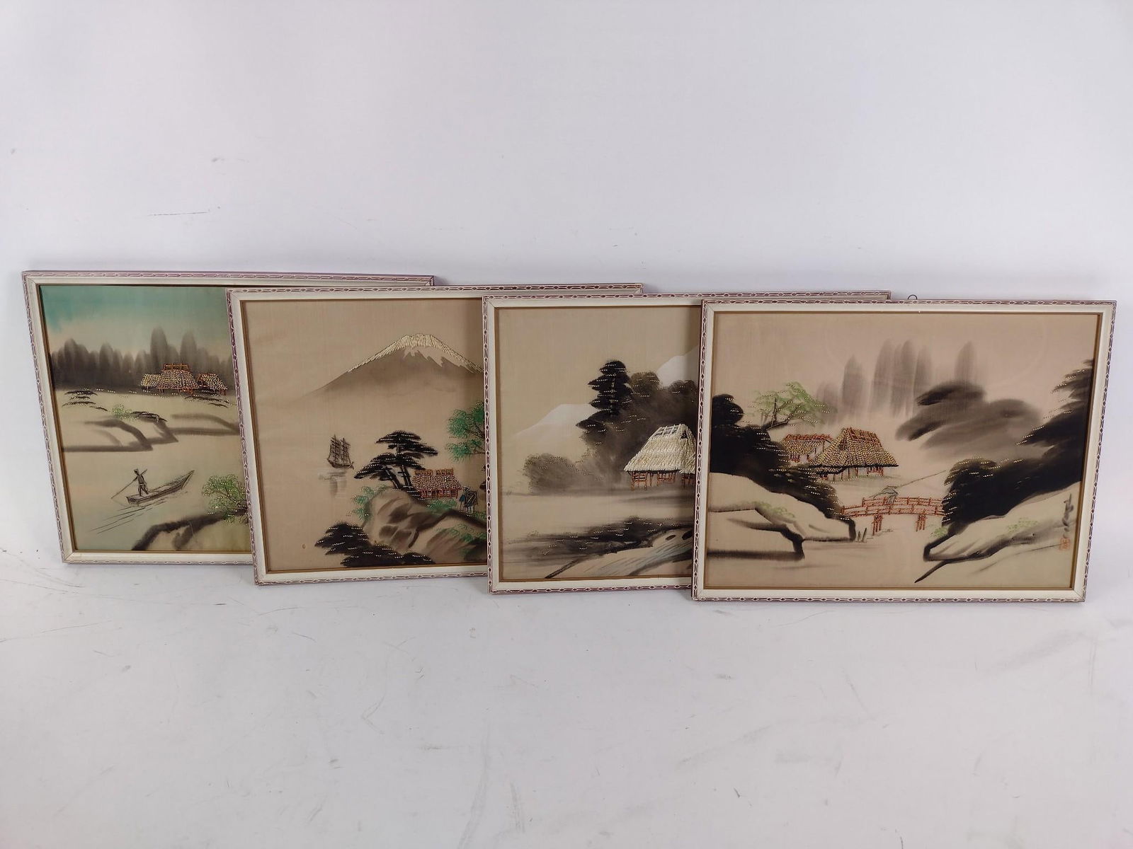 4 Japanese Silk Paintings: NOT ELIGIBLE FOR IN-HOUSE SHIPPING. Includes palace scene, mountain scene, and house scenes. Overall all measure 13" long x 17" wide.