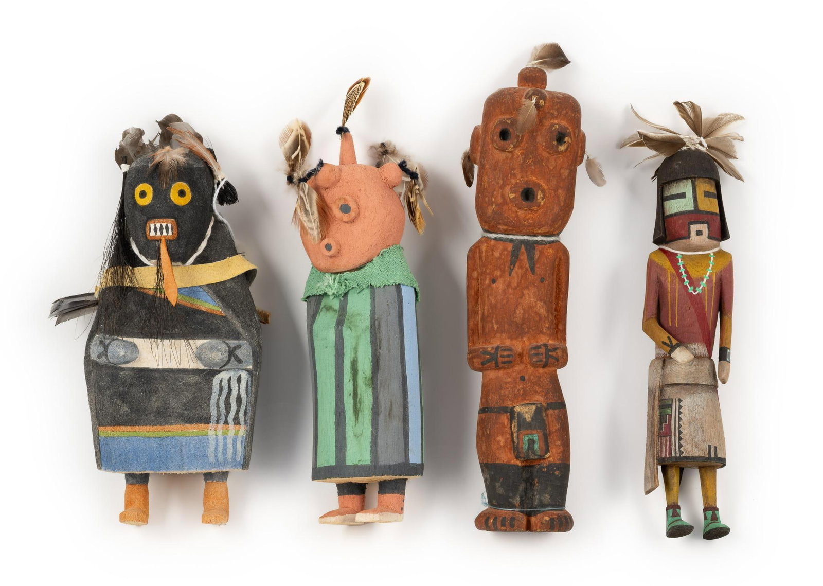 (4) Old Style Hopi Kachinas/Katsina: NOT ELIGIBLE FOR IN-HOUSE SHIPPING. DESCRIPTION: 1) He'e'e' carved by Pat Joshevama; 2) (2) unsigned with one mudhead; 3) Mudhead signed with buttery motif. Old Style Hopi Kachinas, hand-carved with t