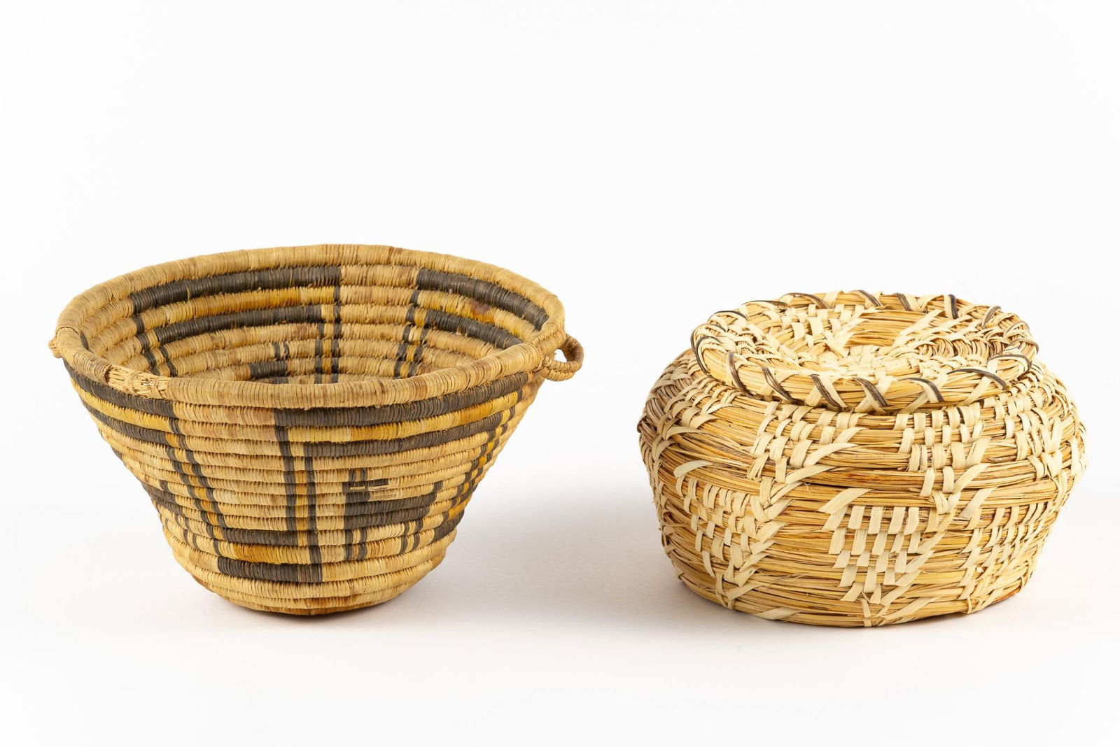 2 Tohono O'odham Baskets: Includes Virginia Moreno, with paperwork. 7-1/4" to 9-1/4" wide x 4" to 5" high.