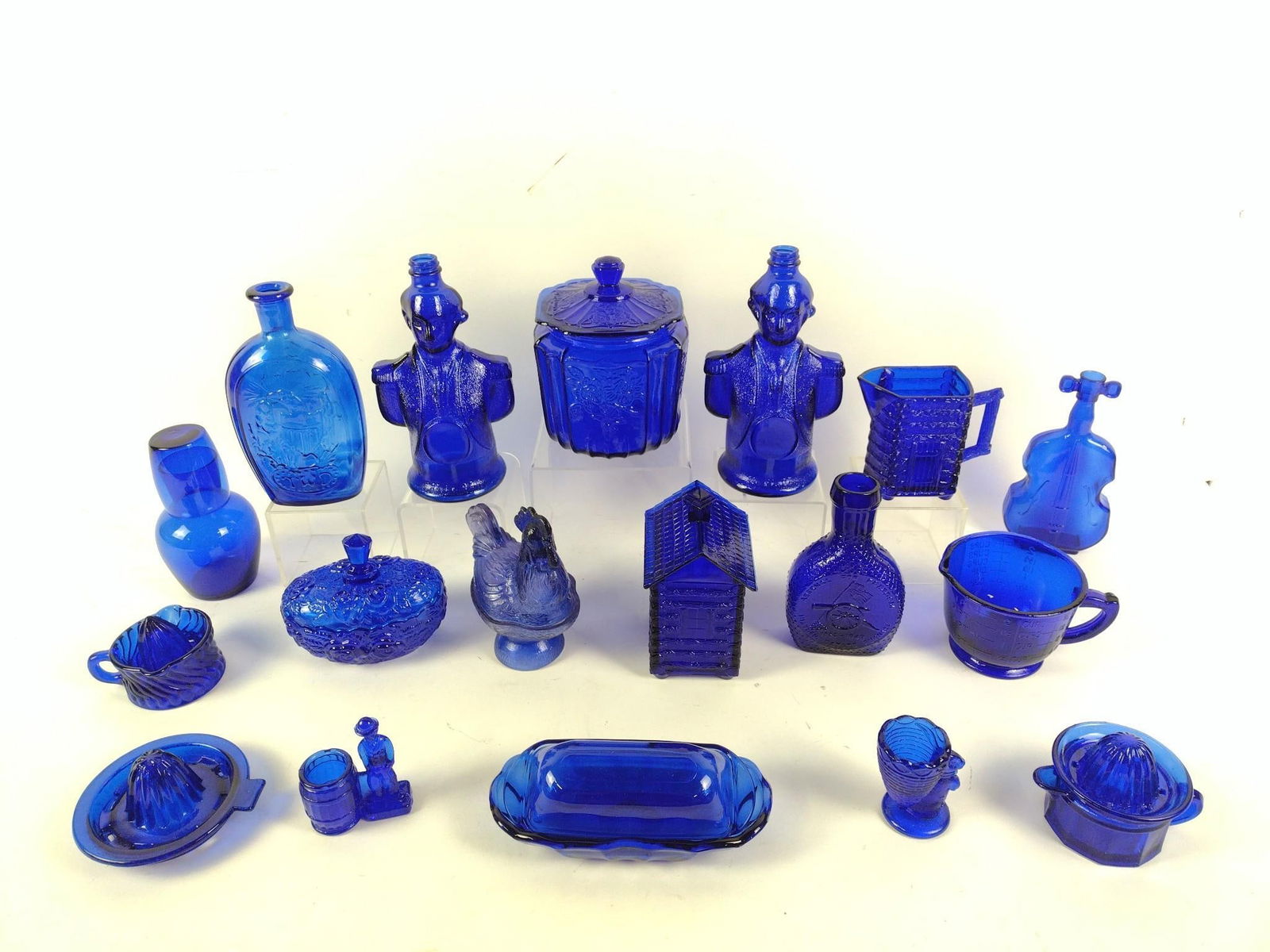18 Blue Glass Kitchenware: 3" to 5-1/2" wide x 3-1/4" to 9-3/4" high.