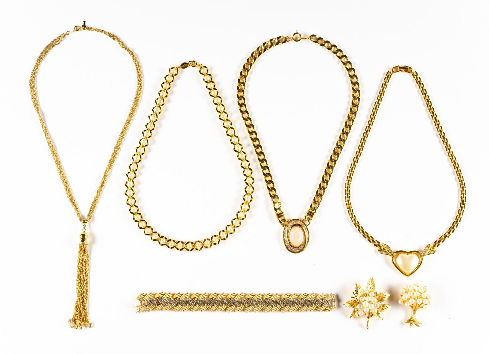 Vintage Trifari Costume Jewelry: Four necklaces, two brooches and a bracelet all signed Trifari except the tassel necklace which has a T metal tag (and may not be Trifari). Necklaces 15" to 17". All pieces are in good condition.