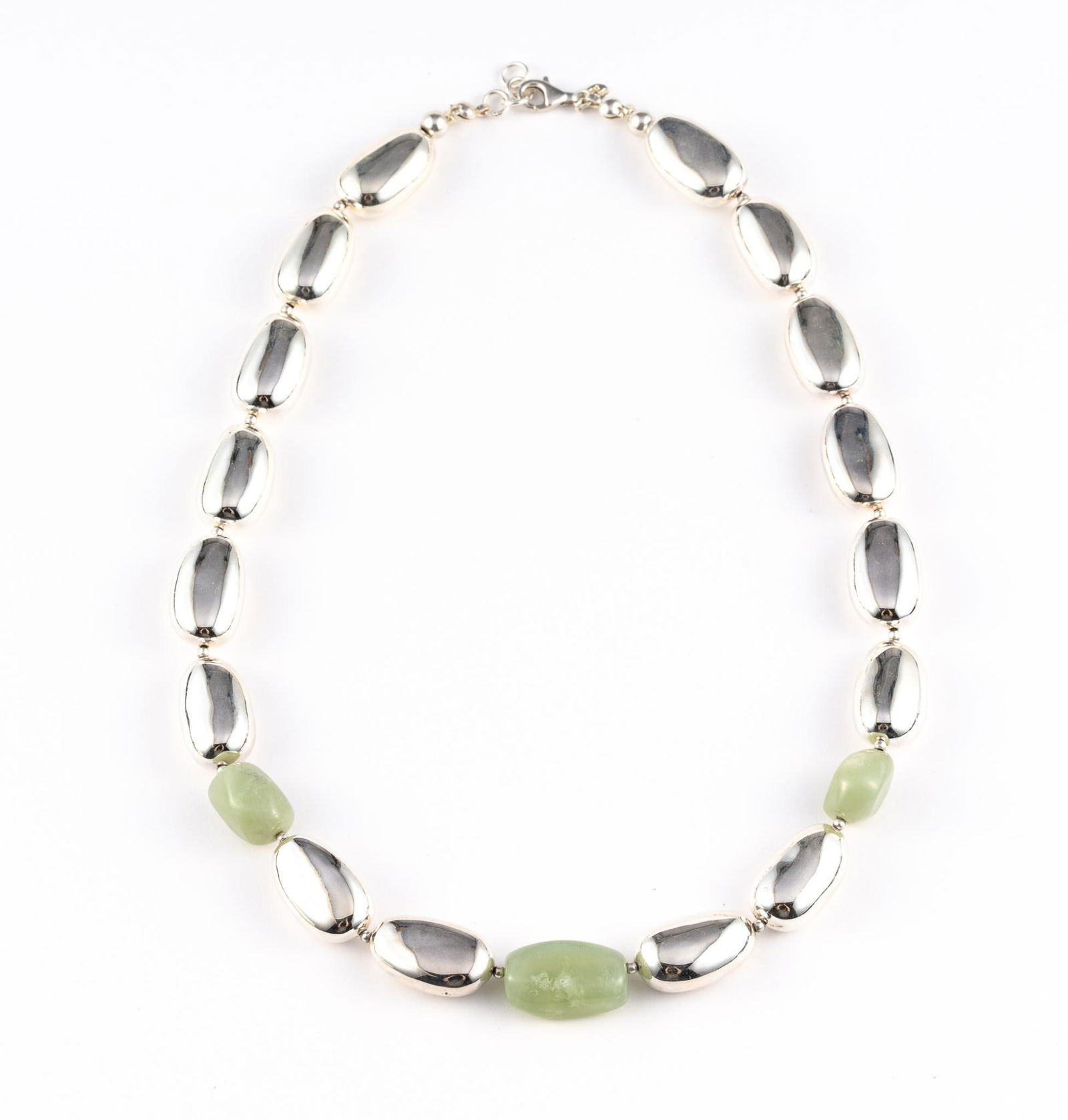 Sterling Silver And Jade Necklace: A bold 20" sterling and jade necklace manufactured in Thailand. It is in new condition and weighs 2.4 troy ounces.