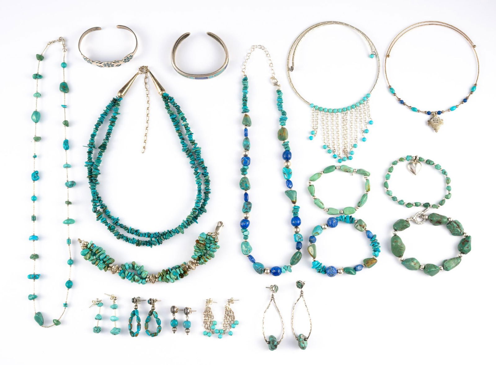 Sterling Silver Lapis And Turquoise Jewelry: Includes necklaces, one with matching earrings, cuff bracelets, nugget bracelets, other earrings. Total weight is 7.9 troy ounces.