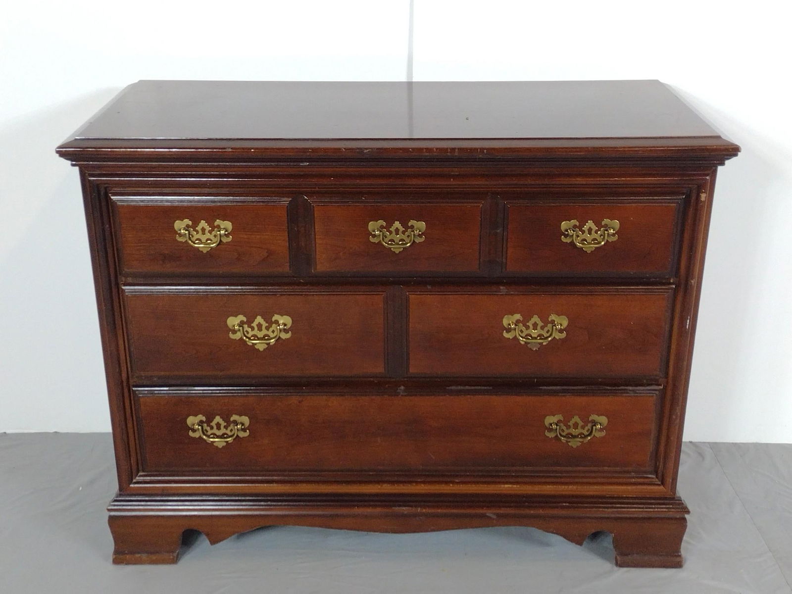 Three Drawer Dresser: NOT ELIGIBLE FOR IN-HOUSE SHIPPING. 42" wide X 18" deep X 32-1/4" high. Has some light scratches. No manufactures name found.
