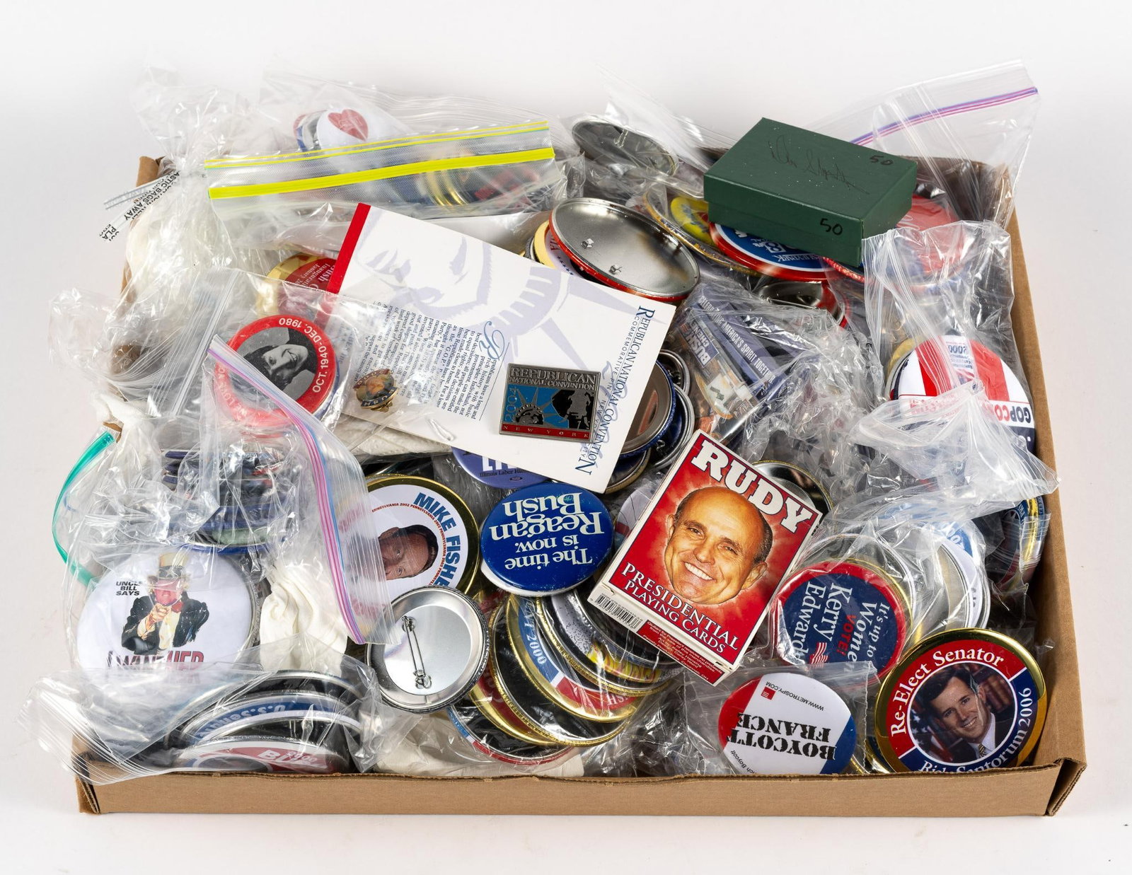 Political Pins and Ephemera: Large lot of political pins and other ephemera, including stickers and a presidential playing card set.