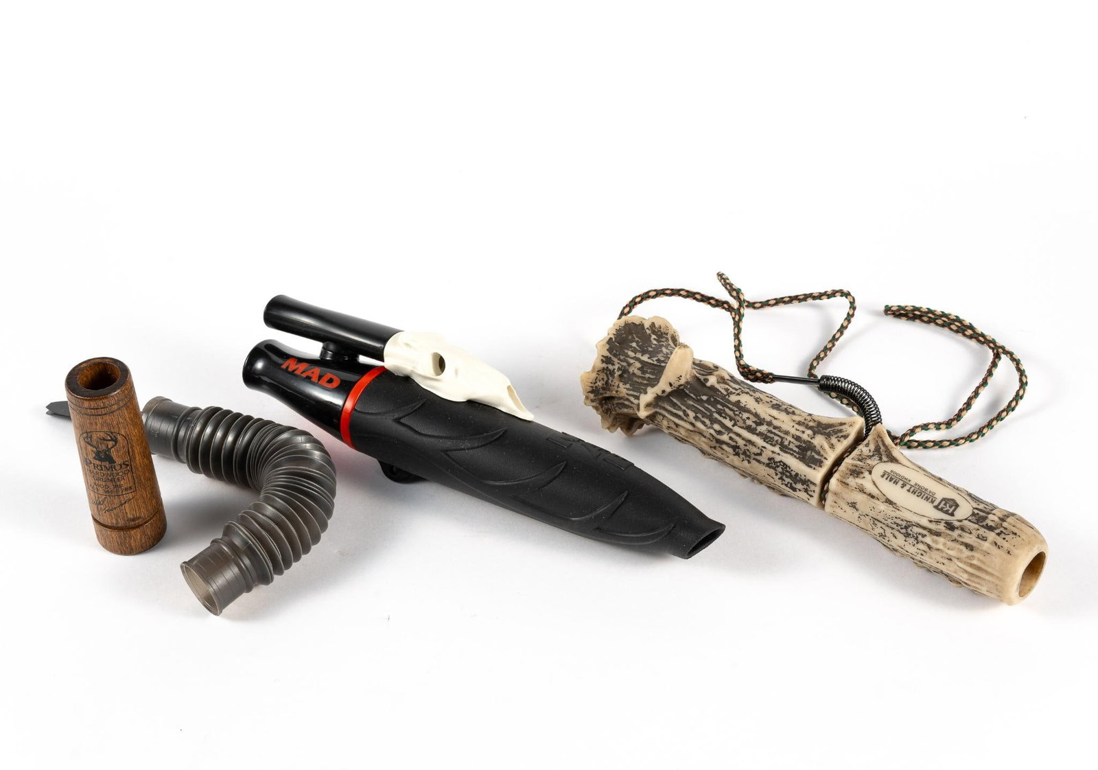 2 Deer Callers and 2 Parts: Includes 2 complete deer callers, a Knight and Hale Da'Bone KHD1008 and a MAD RIP Deer Call. Also includes a part of a Primos Hardwood Grunter and a pipe.
