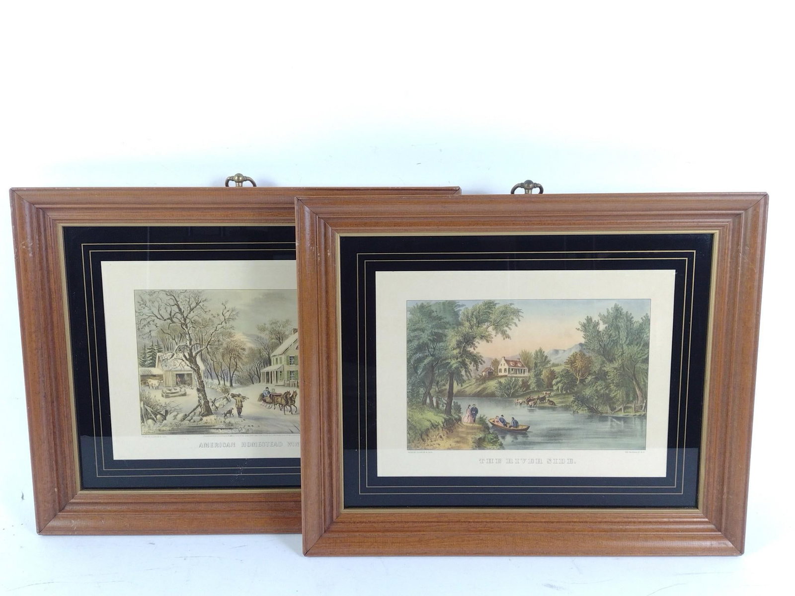 2 Currier & Ives Prints: NOT ELIGIBLE FOR IN-HOUSE SHIPPING. Includes American Homstead Winter and The River Side. Overall 13-1/2" long x 16-1/2" wide.
