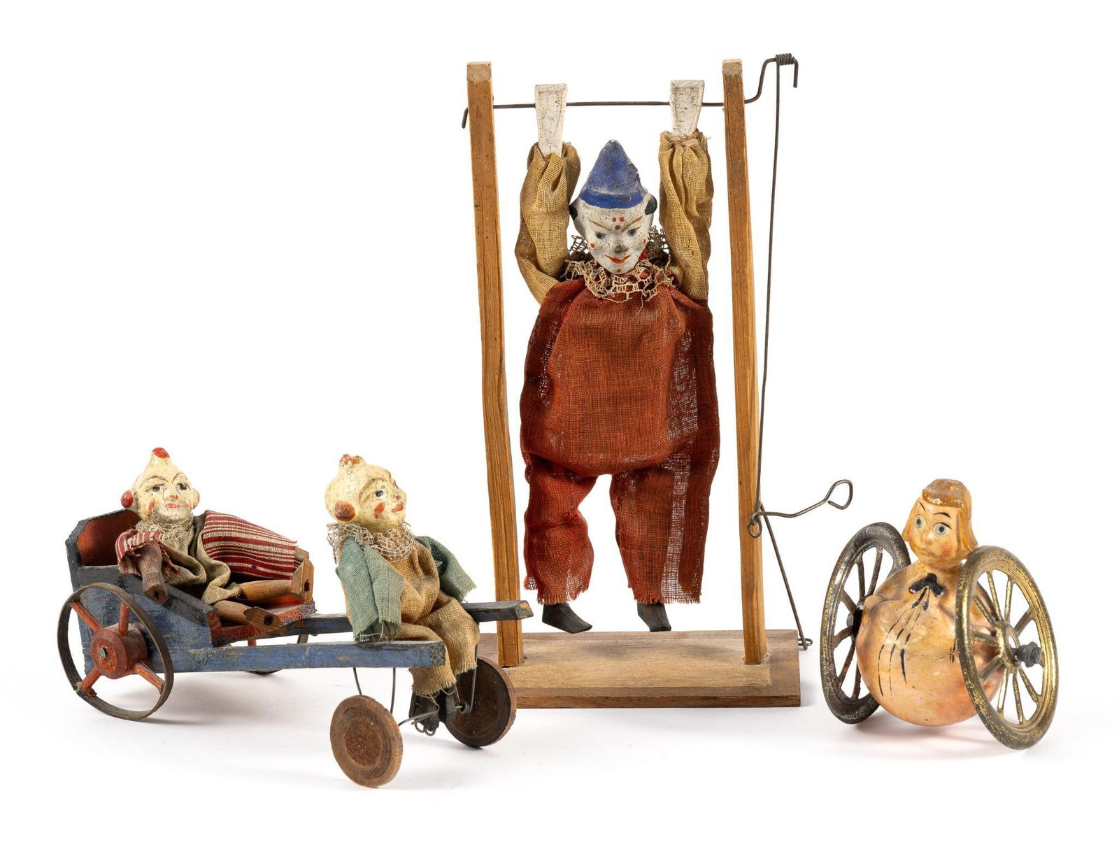 Three Antique German Bisque Head Clown toys Automaton: 19th Century primitive automaton toys including acrobat clown, pedal powered chariot with the pedaling figurine raising and lowering at the knees, and a roly-poly with wheels (one wheel loose on the a