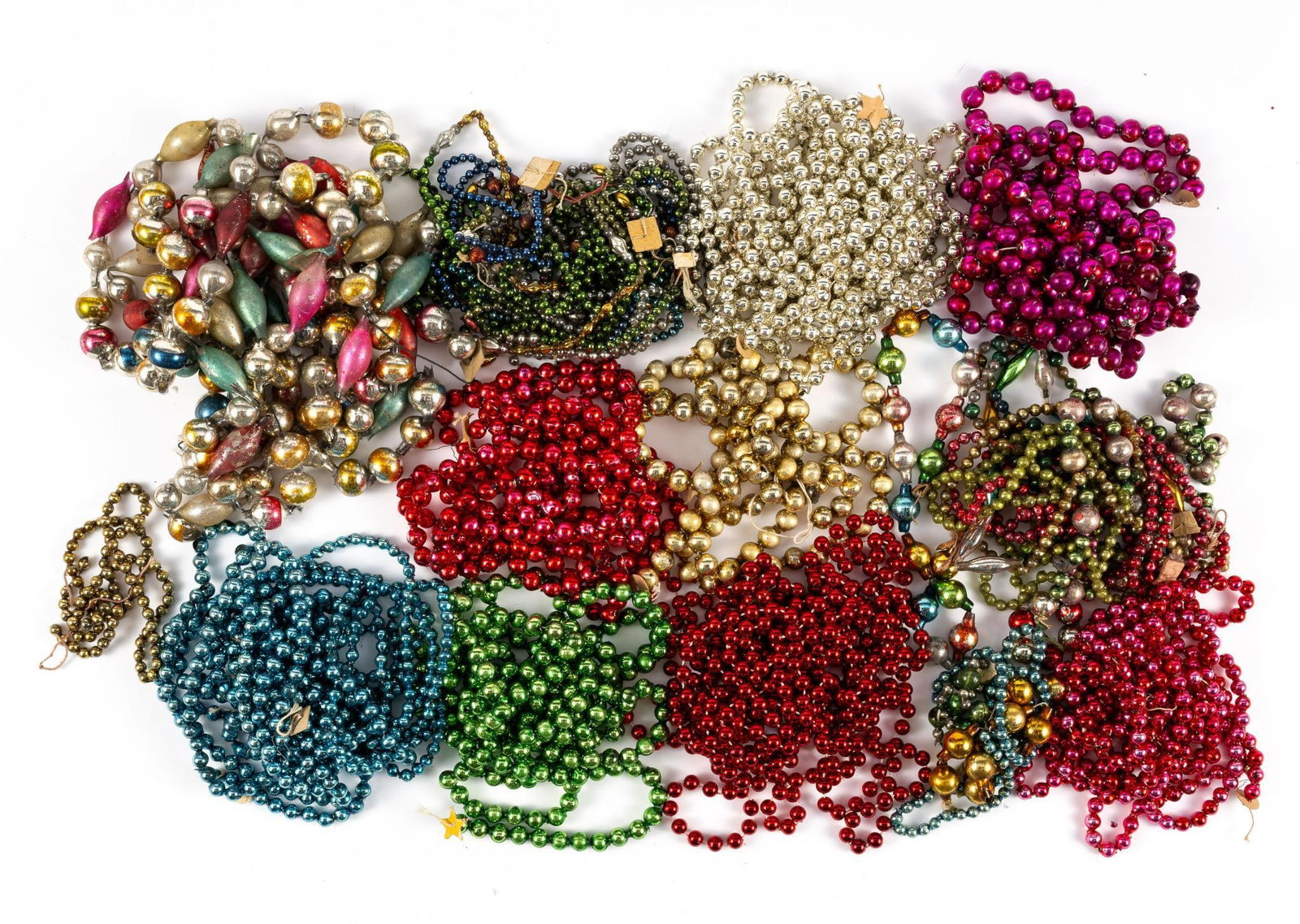 Antique Mercury Glass Christmas Tree Garlands: Fourteen early 20th Century German made glass garlands. Some are complex with a variety of shapes. Scattered breakage exists. This lot is part of a private collection of antique German Christmas ornam