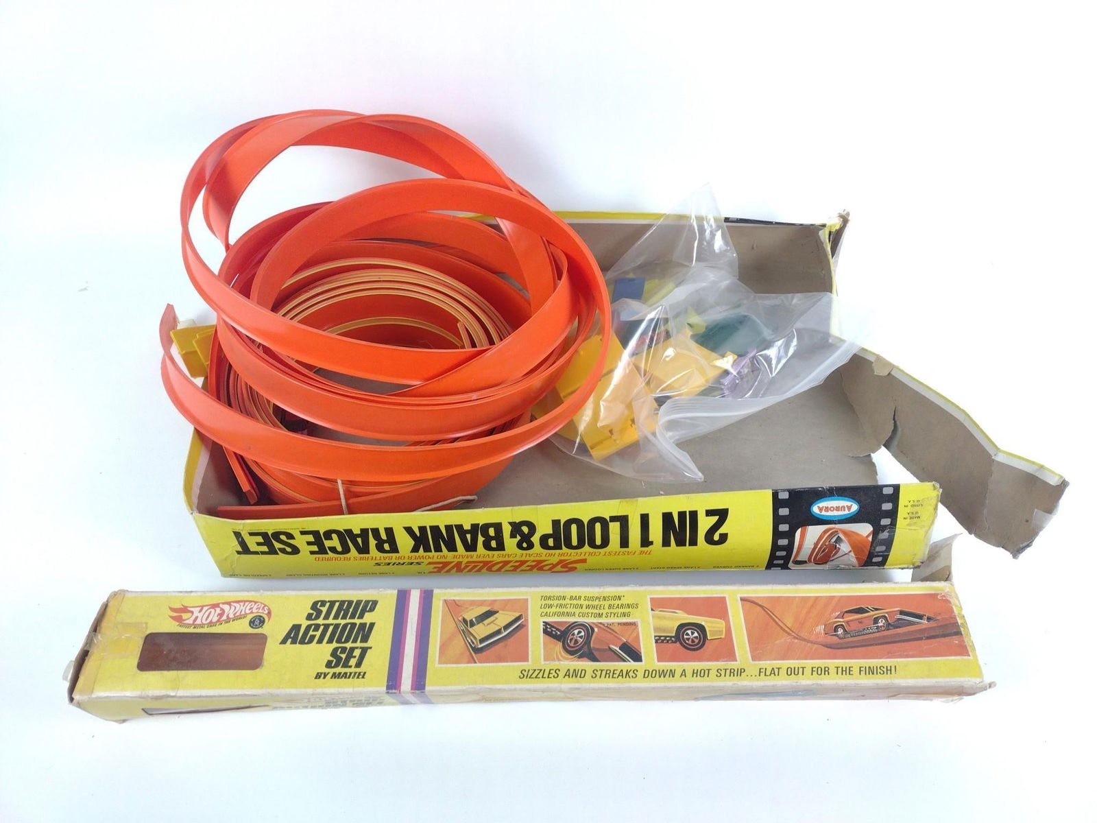 Lot of Toy Race Car Items, incl Aurora Hot Wheel Set: Includes Aurora Hot Wheel Set, long tracks, cars, and Speedline pieces. Approximately 15" wide and 24" long.