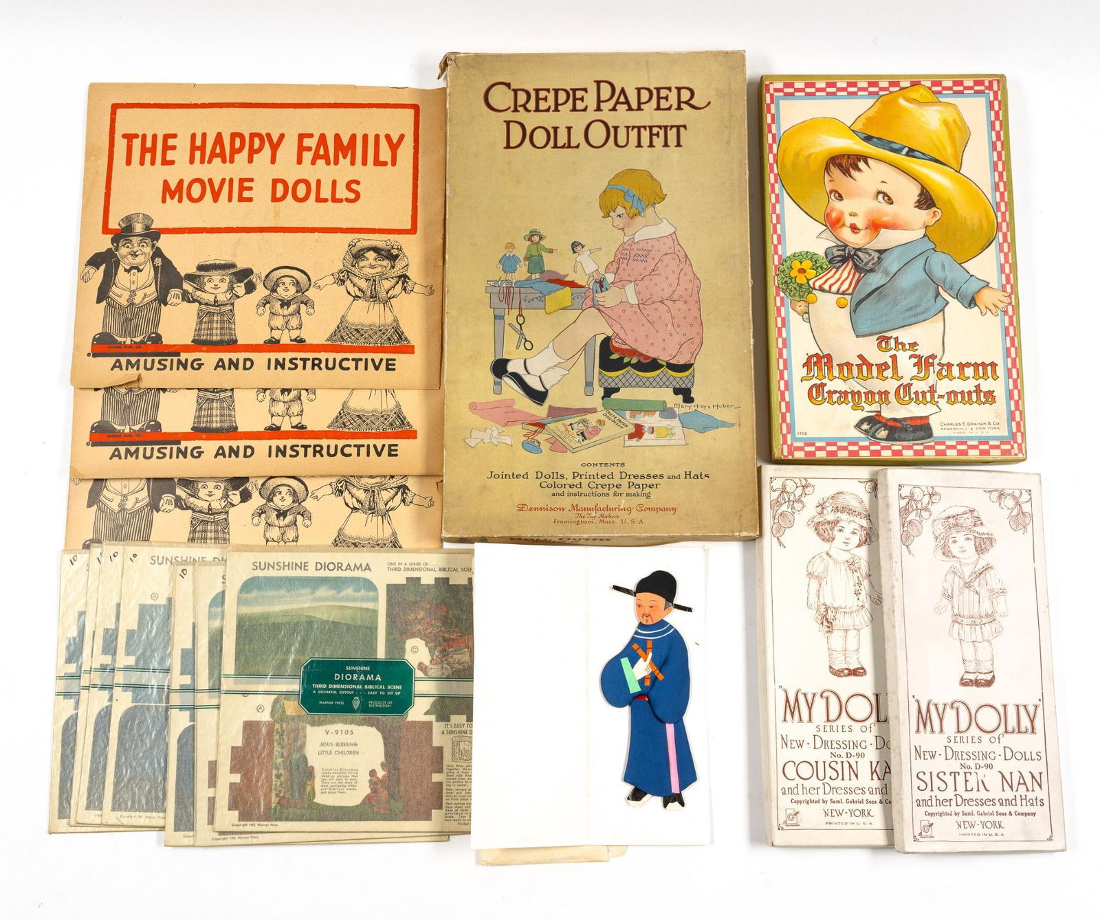 15 Paper/Cut-Out Dolls & Scenes: Includes Sunshine Diorama; The Happy Family Movie Dolls; My Dolly; The Model Farm Dragon Cut-Outs; and Crepe Paper Doll Outfit. All in original packaging.